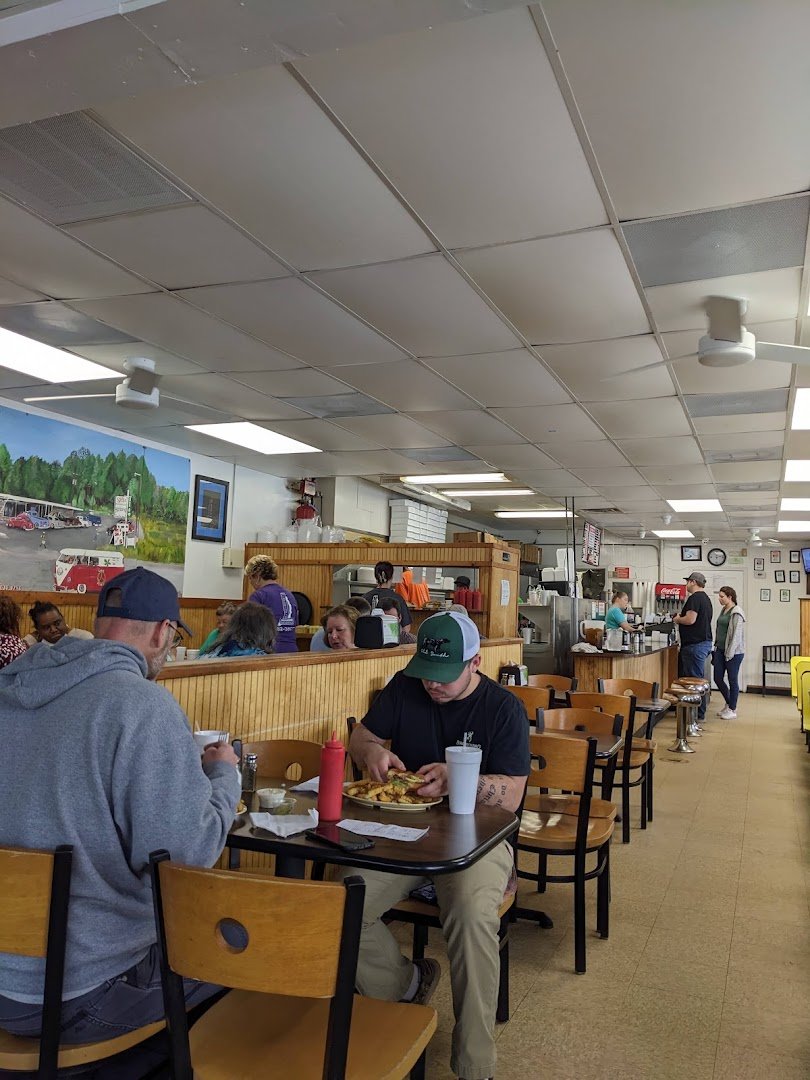 Classic diner counter with booths and warm lighting.